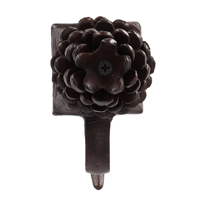 Öntöttvas karácsonyi zoknitartó fenyőtoboz díszítéssel